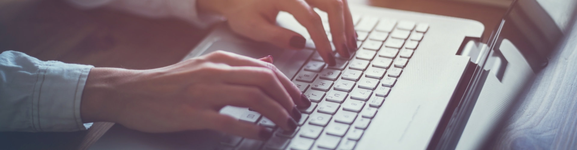 hands on a laptop keyboard